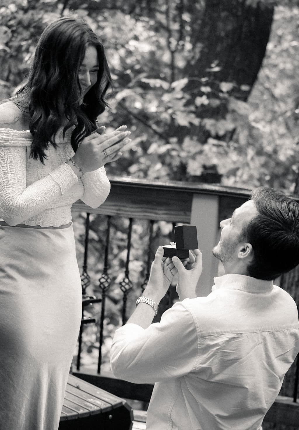 Black and white: Chandler kneeling with the ring box