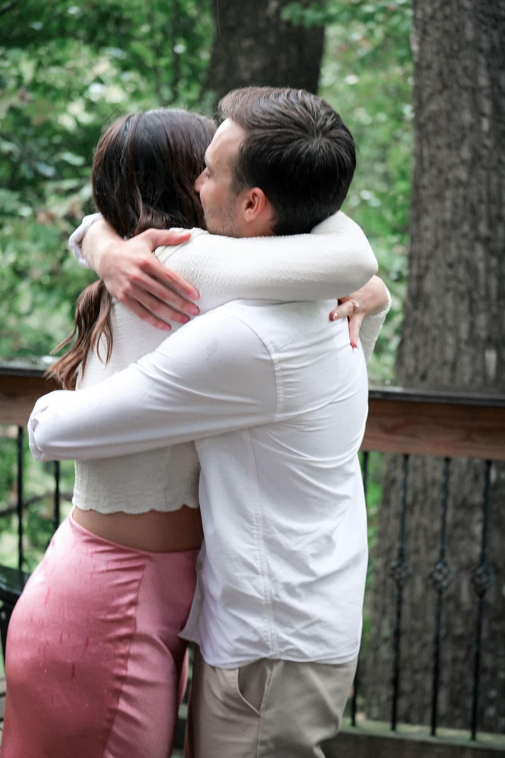 Caroline and Chandler in a tight hug