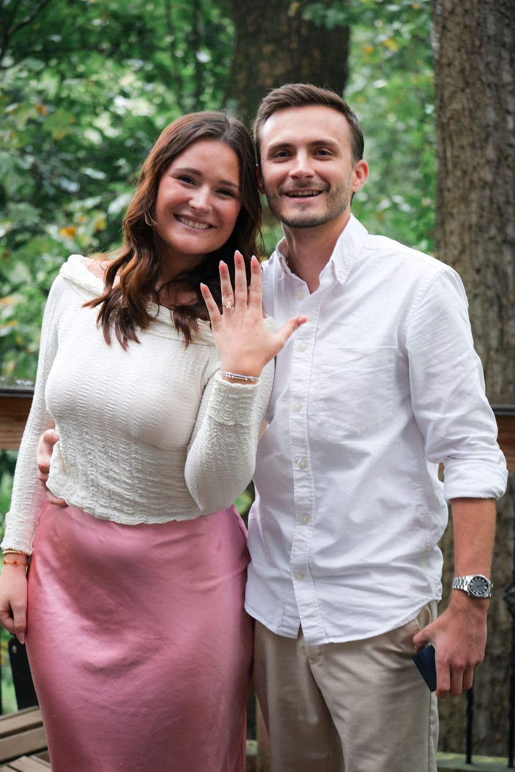 Caroline showing off the ring beside Chandler