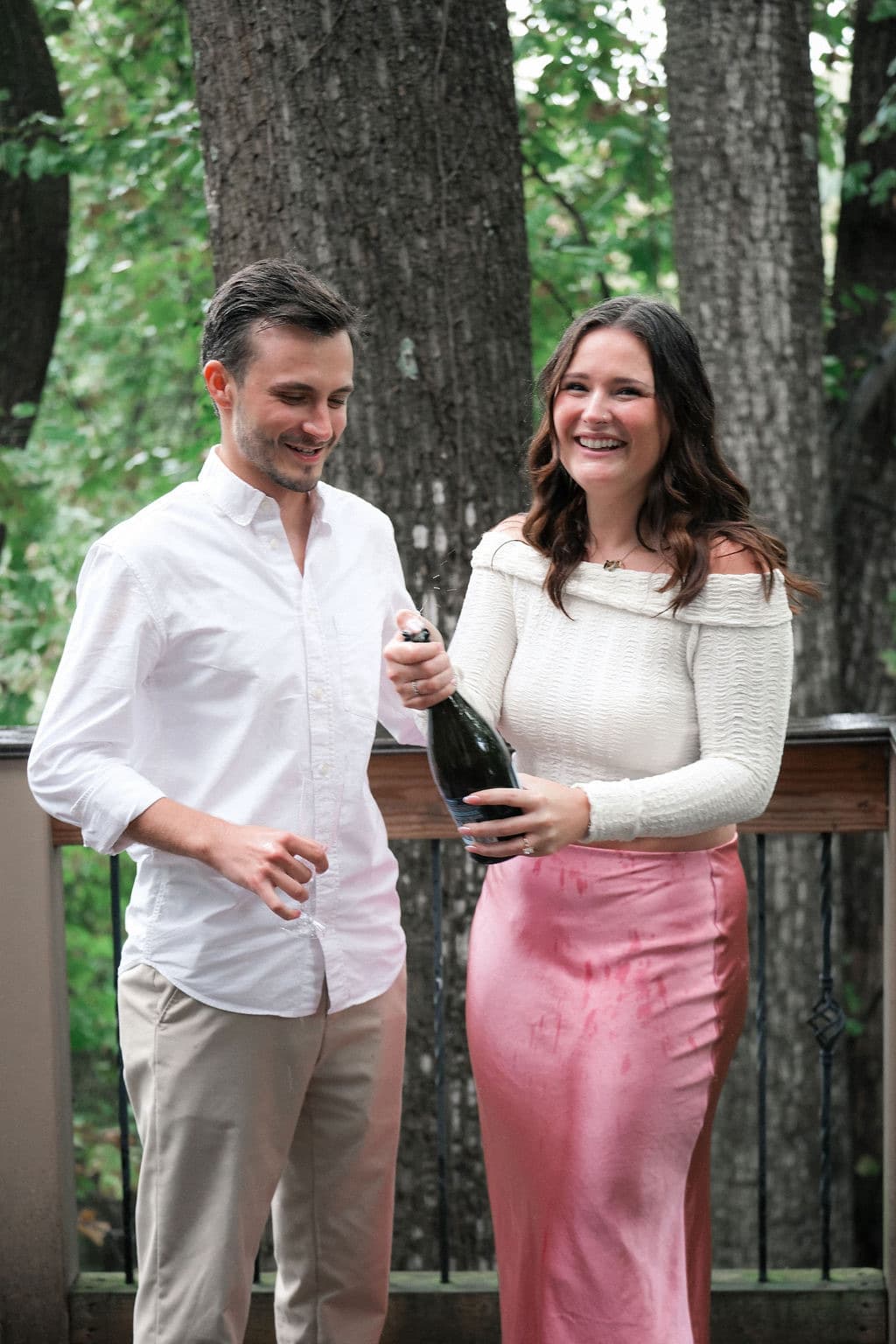 Caroline laughing with the bottle in hand
