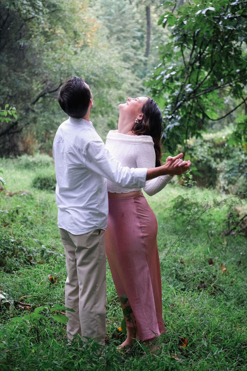 Both looking up at the trees
